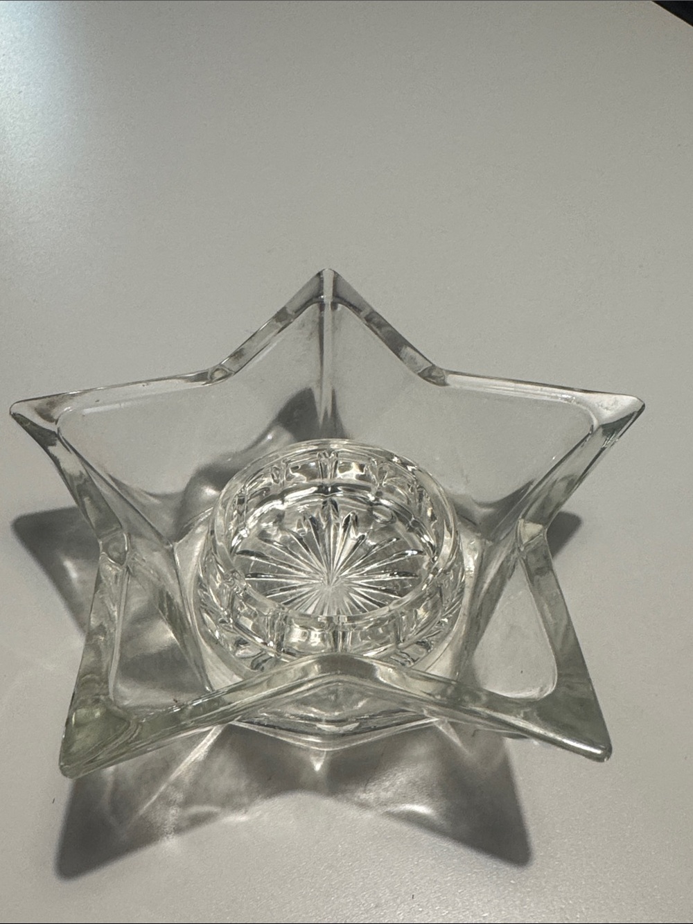 Clear star-shaped tea light holder
